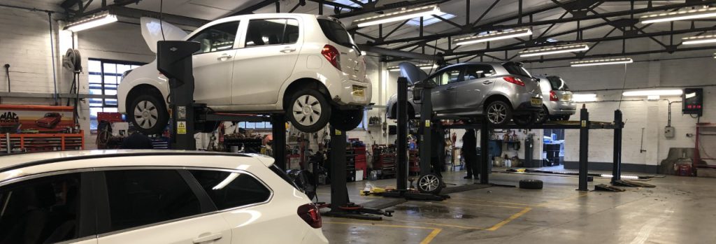 Vehicles up on a service ramp - Car Servicing Nottingham